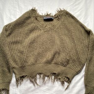Cropped green knit sweater